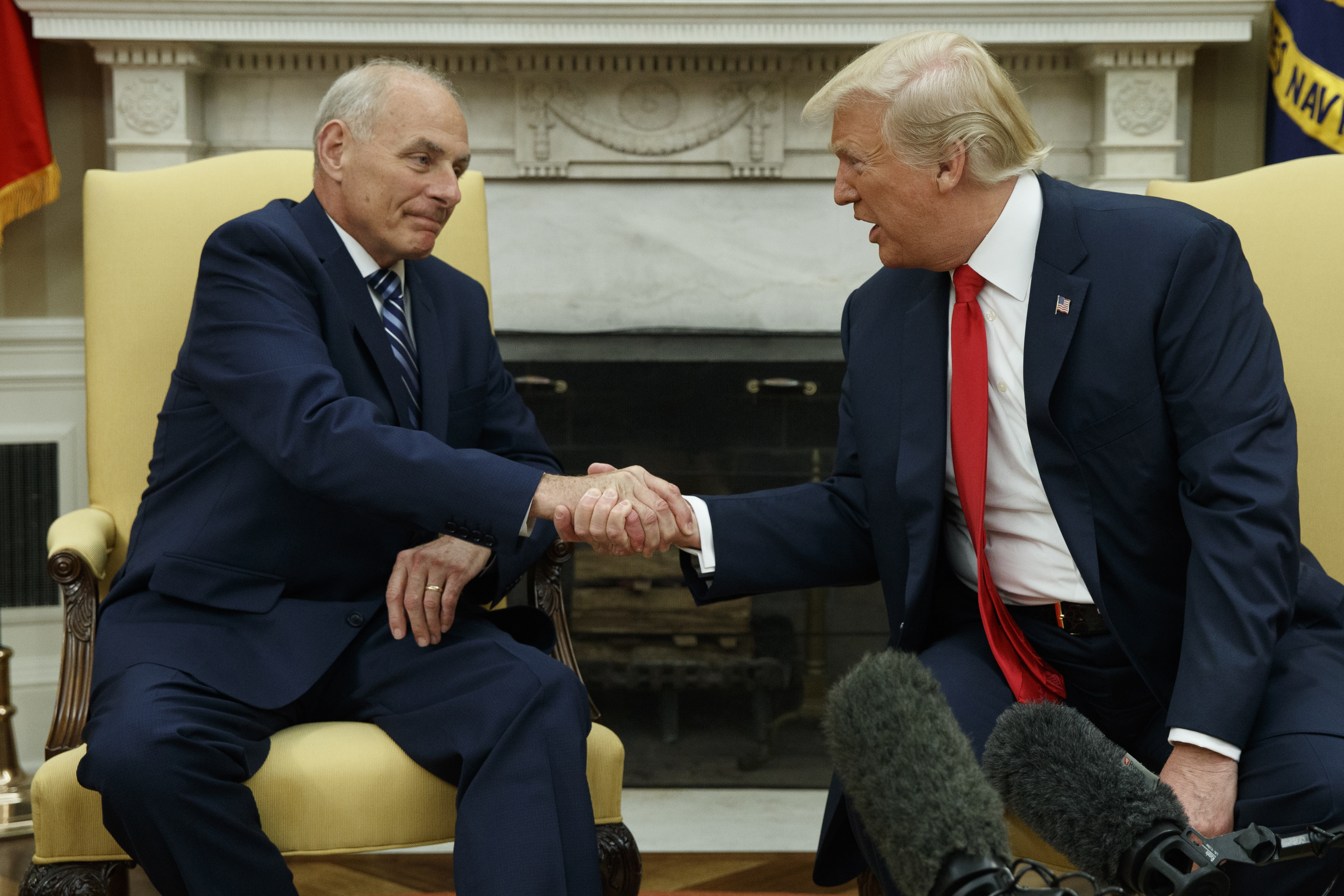 President Donald Trump talks with new White House Chief of Staff John Kelly