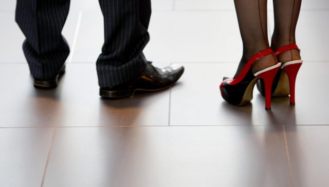 Researchers have called for action to stop women being forced to wear high heels at work 