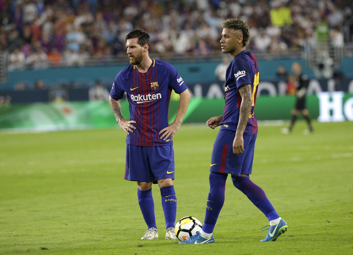 Barcelona's Lionel Messi, left, and Neymar, right, stand on the field during a break in the action during the first half of an International Champions Cup soccer match against Real Madrid, Saturday, July 29, 2017, in Miami Gardens, Fla. (AP Photo/Lynne Sladky)