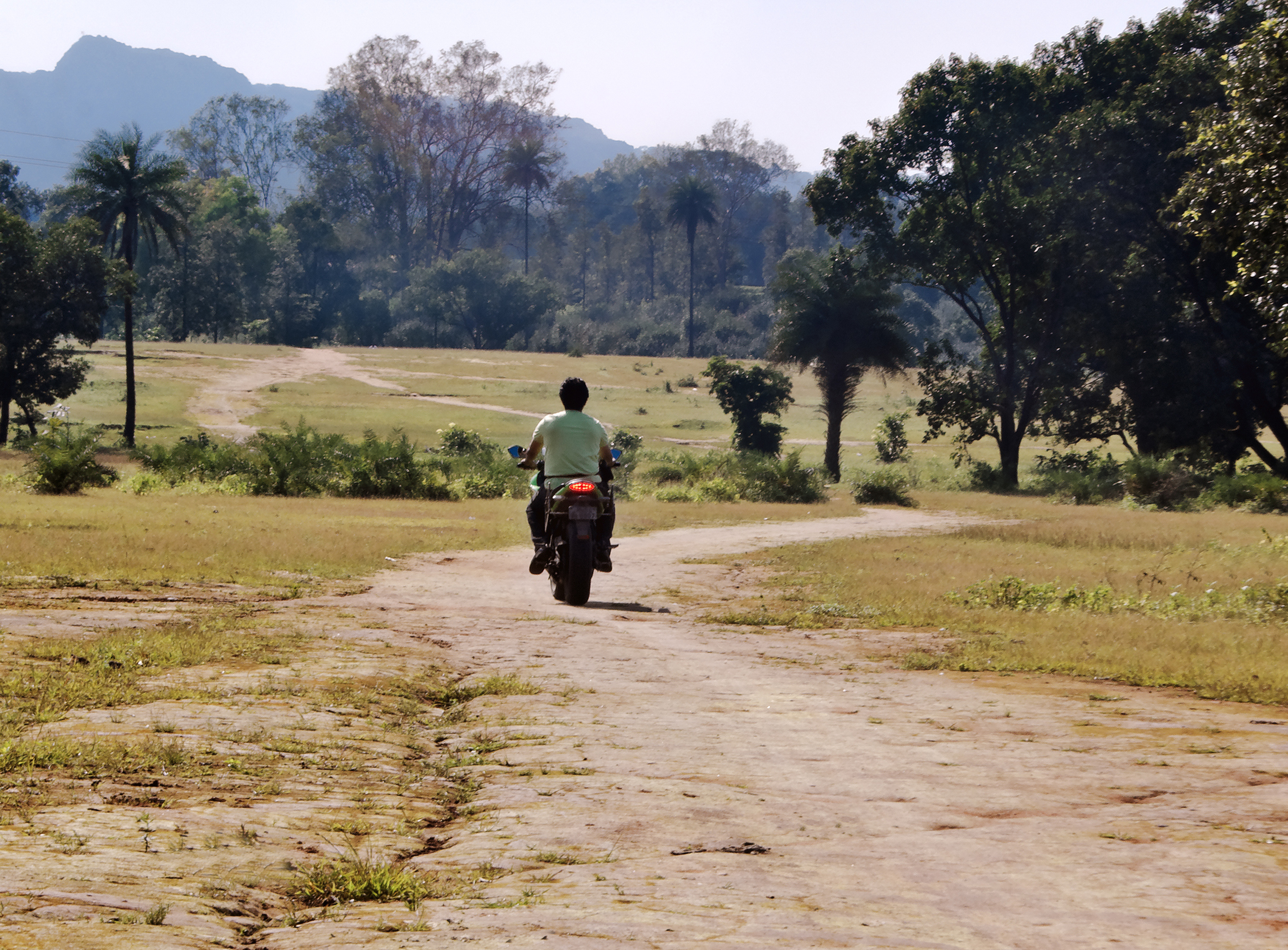 Indian farmer on a moped.