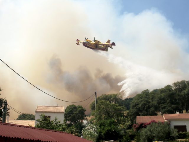 Aircraft have been used to help put out fires in Corsica (Raphael Poletti/AP)