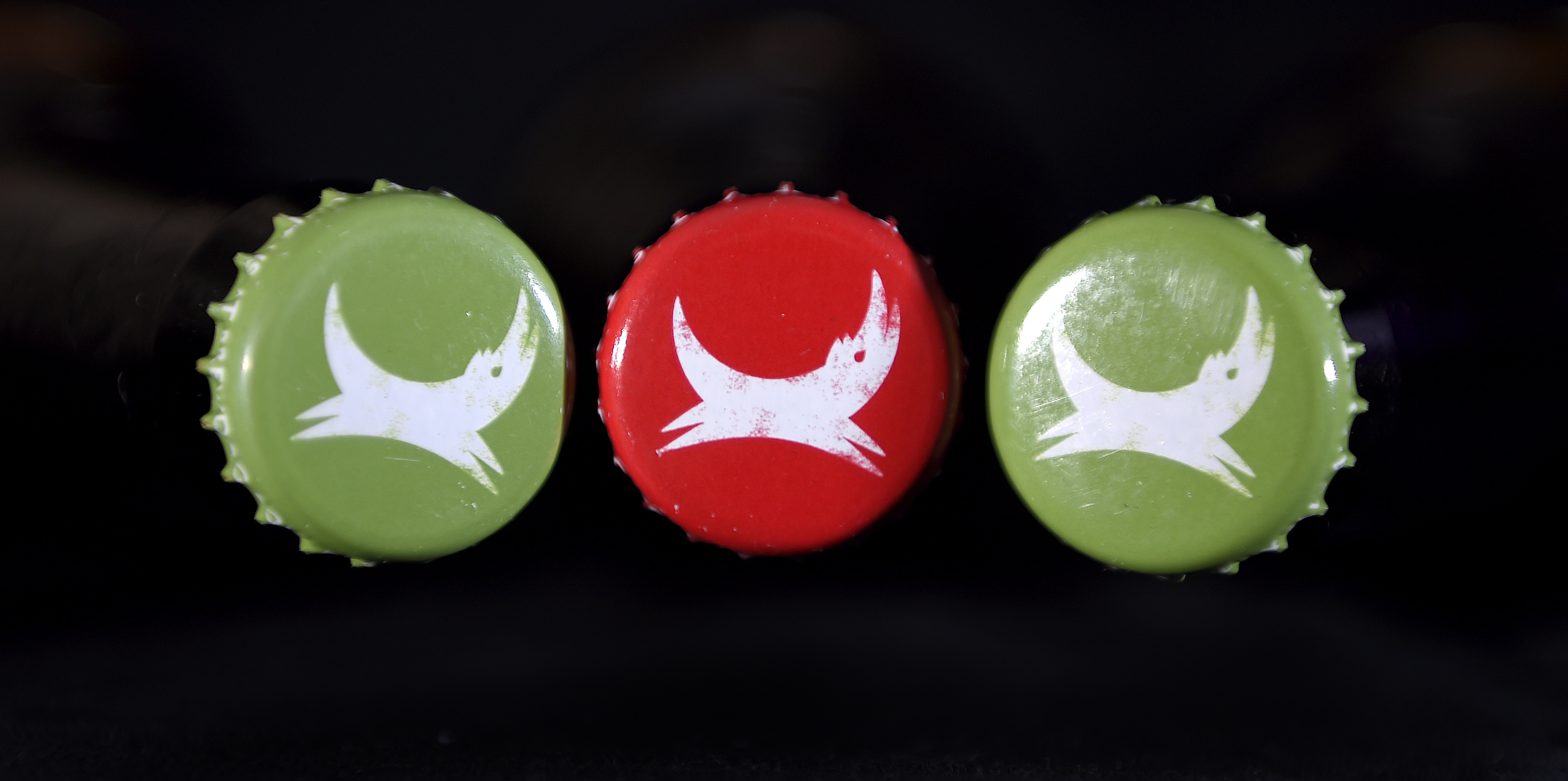 Bottle tops of Brewdog's Dead Pony Pale Ale and Five AM Red Ale showing the company's logo, as the craft beer company is to expand with the creation of 130 jobs.