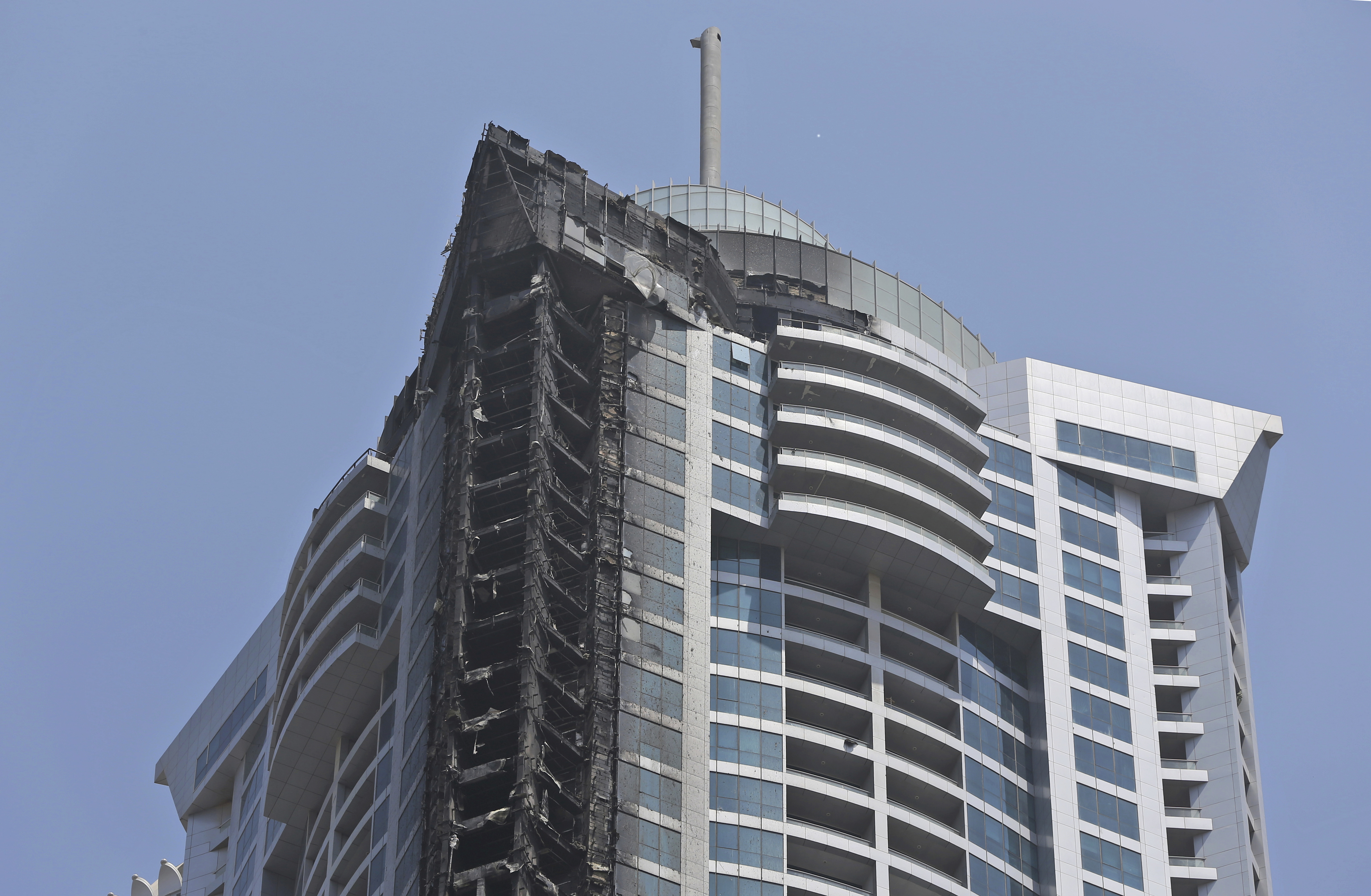 Fire damage on the Torch Tower the morning after (Kamran Jebreili/AP)