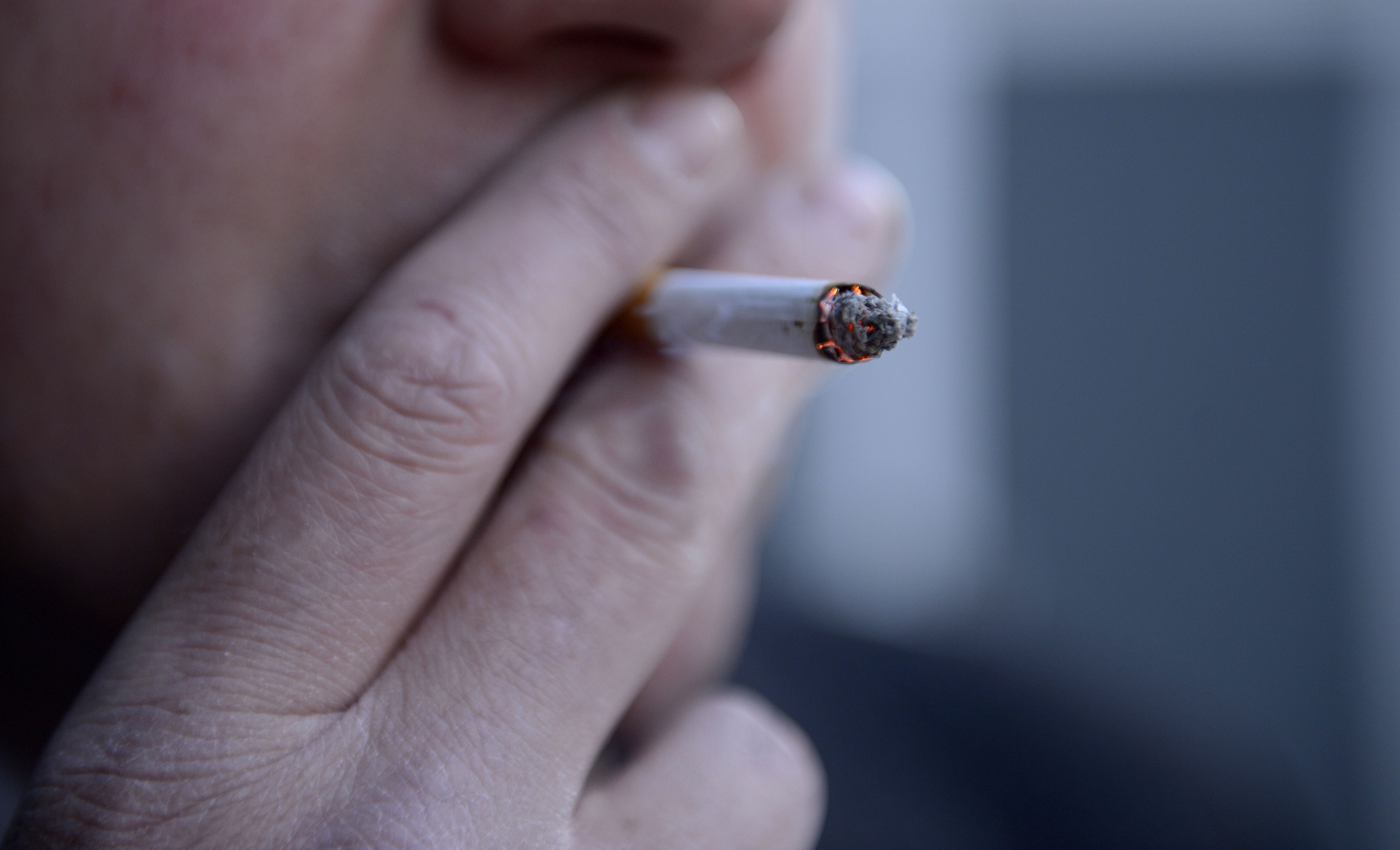 a man smoking a cigarette