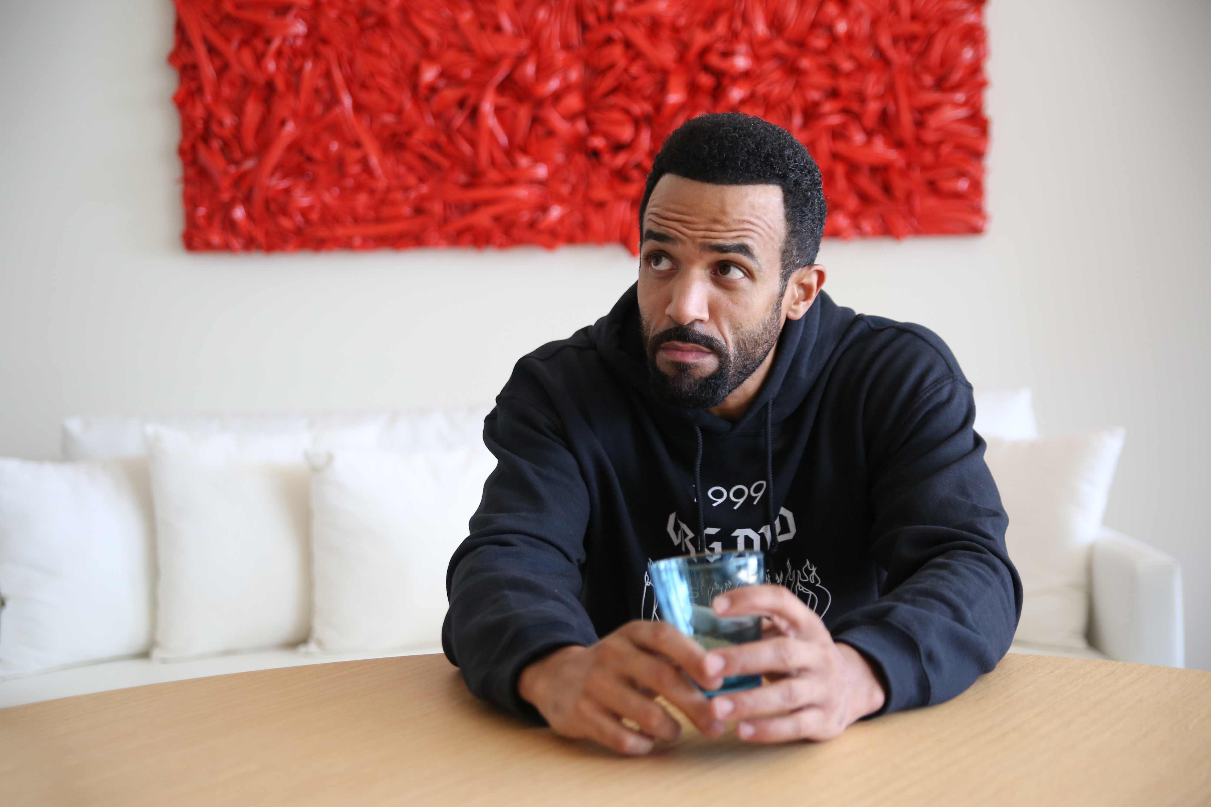 Craig David wearing a hoodie from his Selfridges fashion Collection