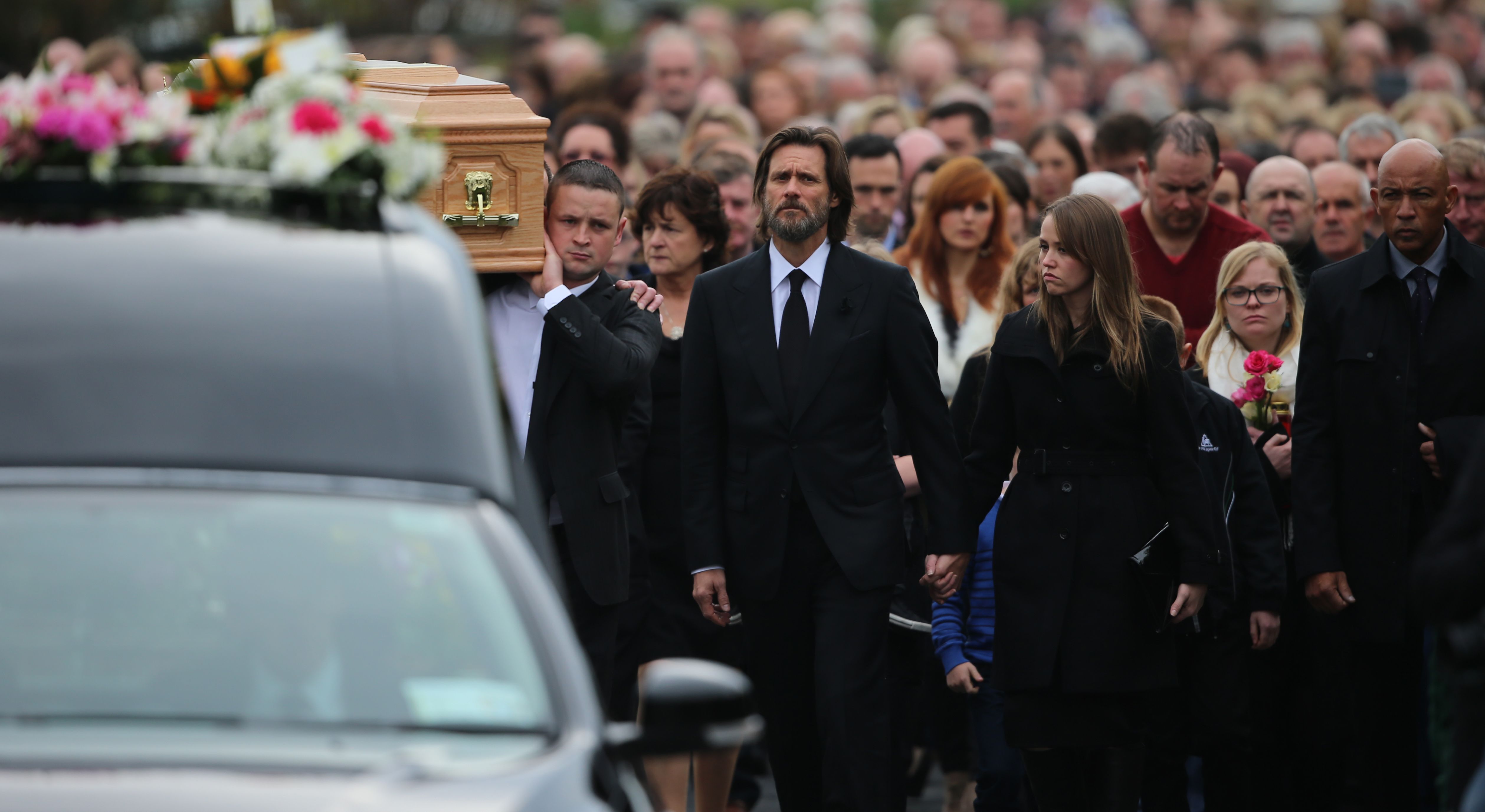 Jim Carrey with mourners