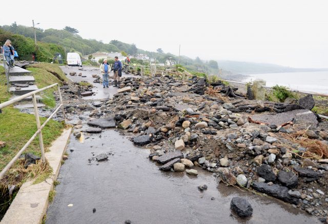 Debris on the road in Coverack, Cornwall (PA)