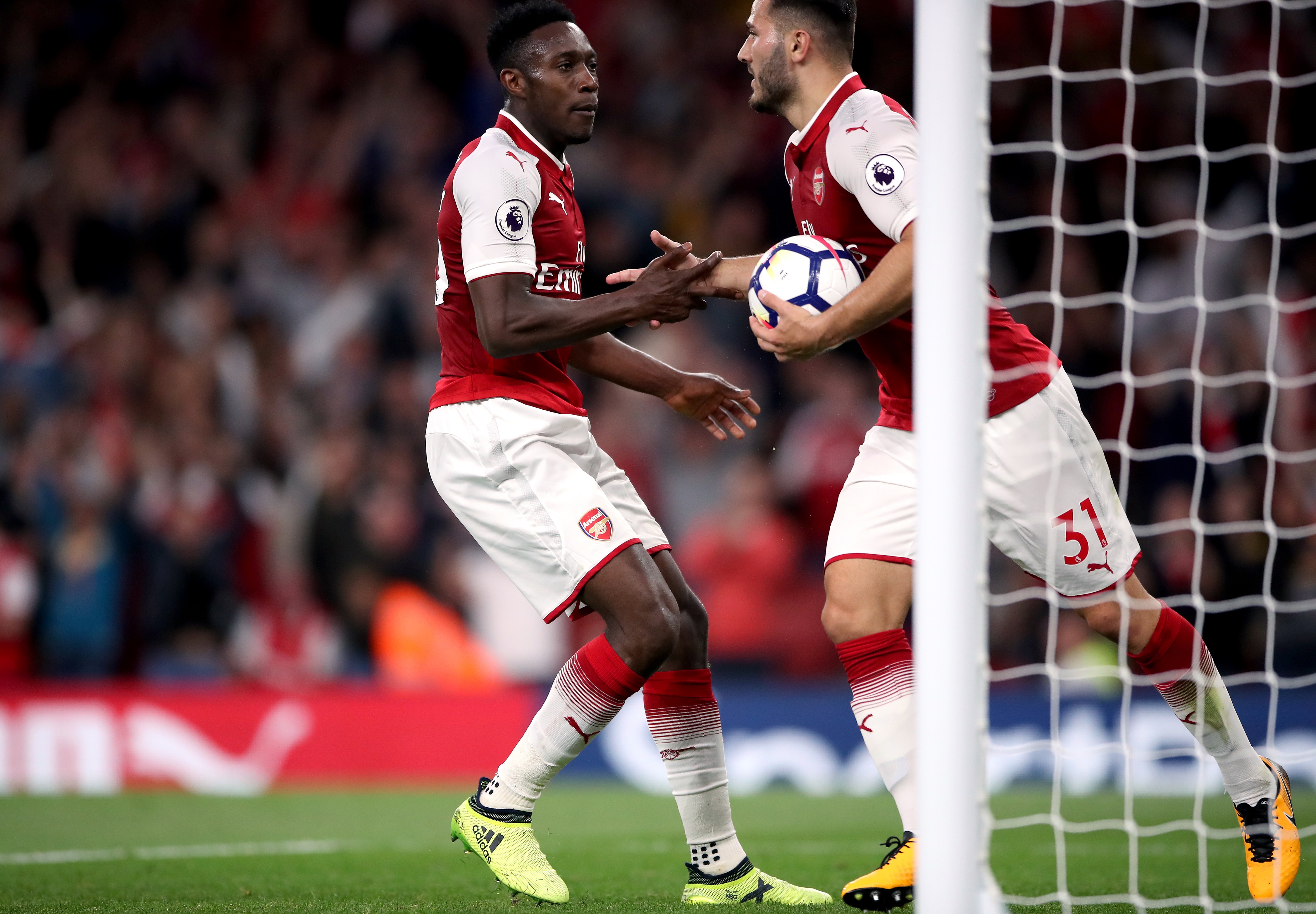 Welbeck celebrates with Kolasinac