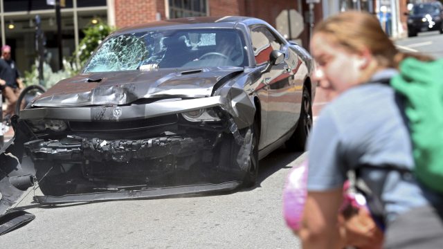 The damage to the car can be seen after hitting protesters