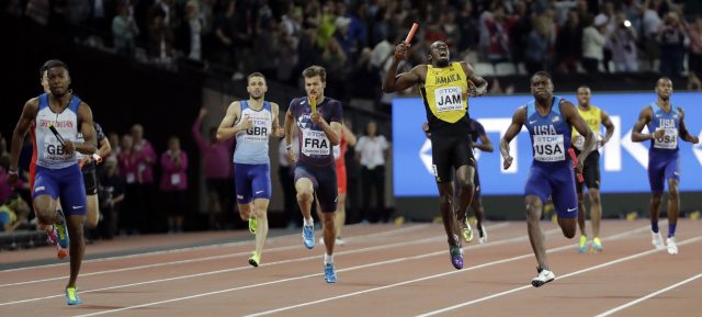 Usain Bolt pulls up injured in the final of the Men's 4x100m (David J Phillip/AP)