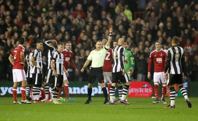 Shelvey receives a red card from referee Stephen Martin after a challenge on Nottingham Forest's Henri Lansbury (David Davies/PA)