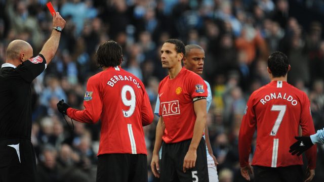 Referee Howard Webb shows Ronaldo a red card for two bookable offences against Manchester City