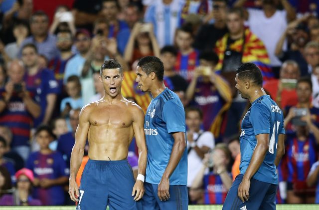 Ronaldo was yellow carded for taking his shirt off while celebrating his goal (Manu Fernandez/AP)