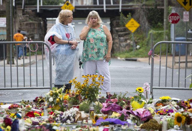 Floral tributes are laid to honour Heather Heyer who died when a car rammed into a group of counterprotesters