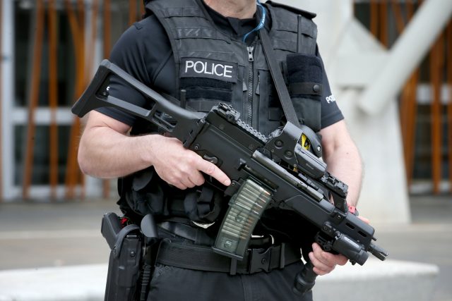 An armed police officer on patrol