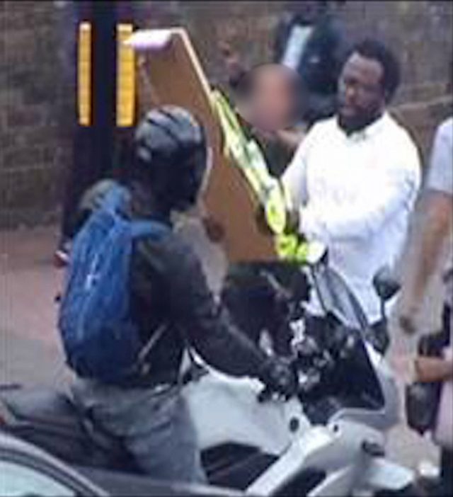 Still issued by the Metropolitan Police of a suspect (right) they would like to speak to in connection with violent disorder following a demonstration in Hackney