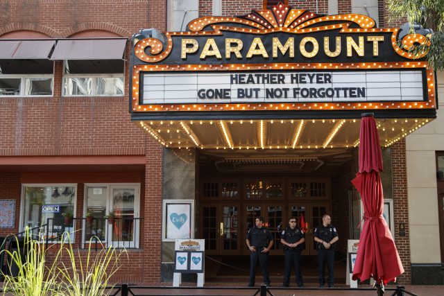 Police officers stand outside the Paramount Theatre in Charlottesville
