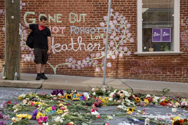Jason Charter, of Washington stands at the site where Heather Heyer was killed during a white nationalist rally
