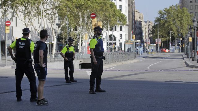 Police officers cordon off a street in Barcelona