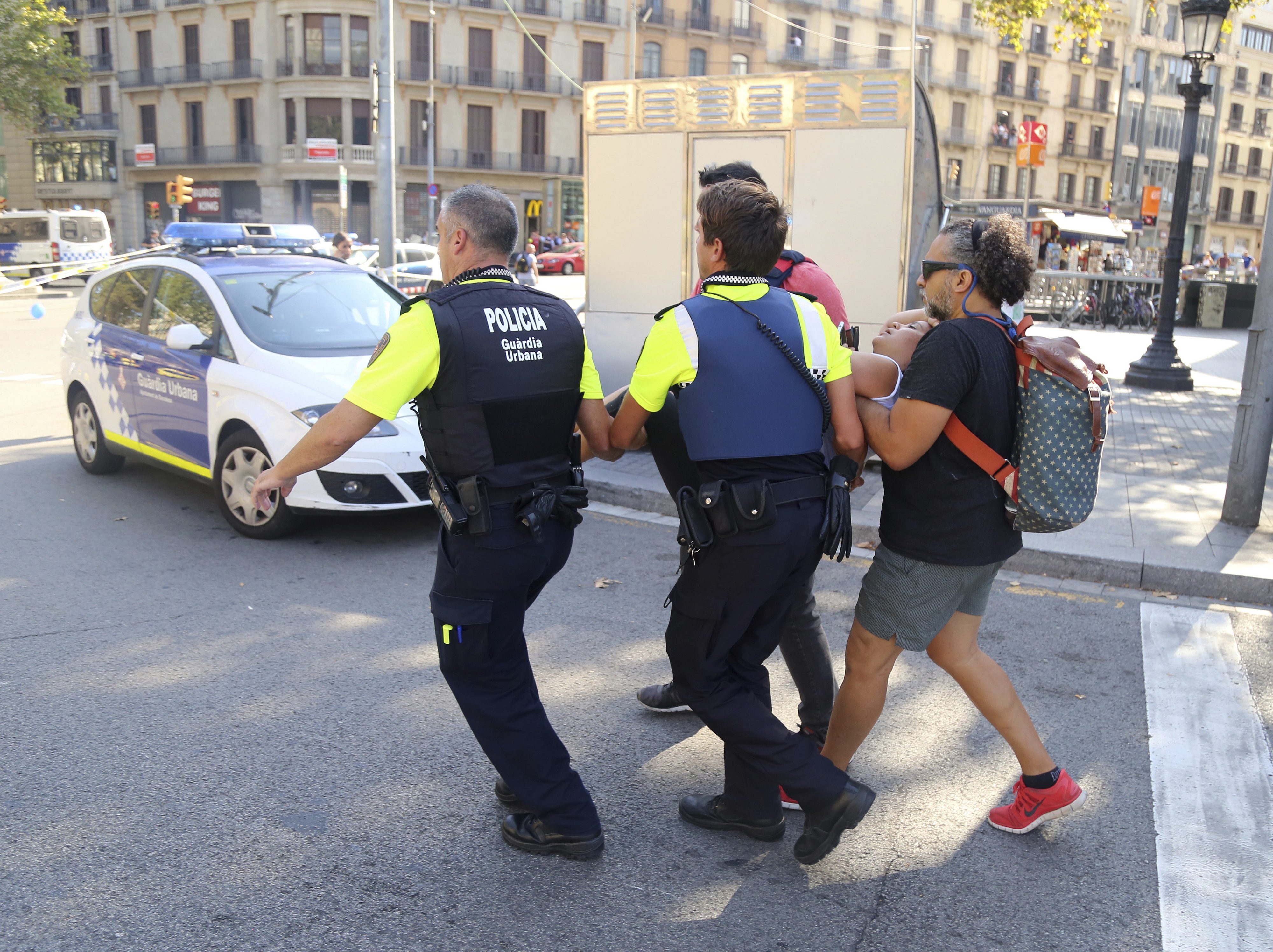 An injured person is carried away in Barcelona