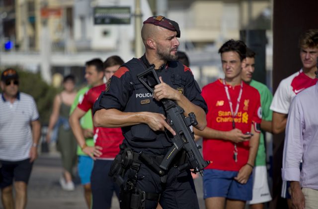 An armed policeman on patrol in Cambrils, Spain