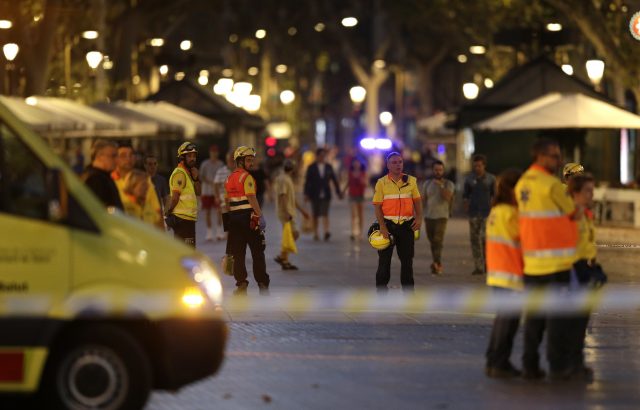 Emergency workers on a blocked street in Barcelona after a terror attack