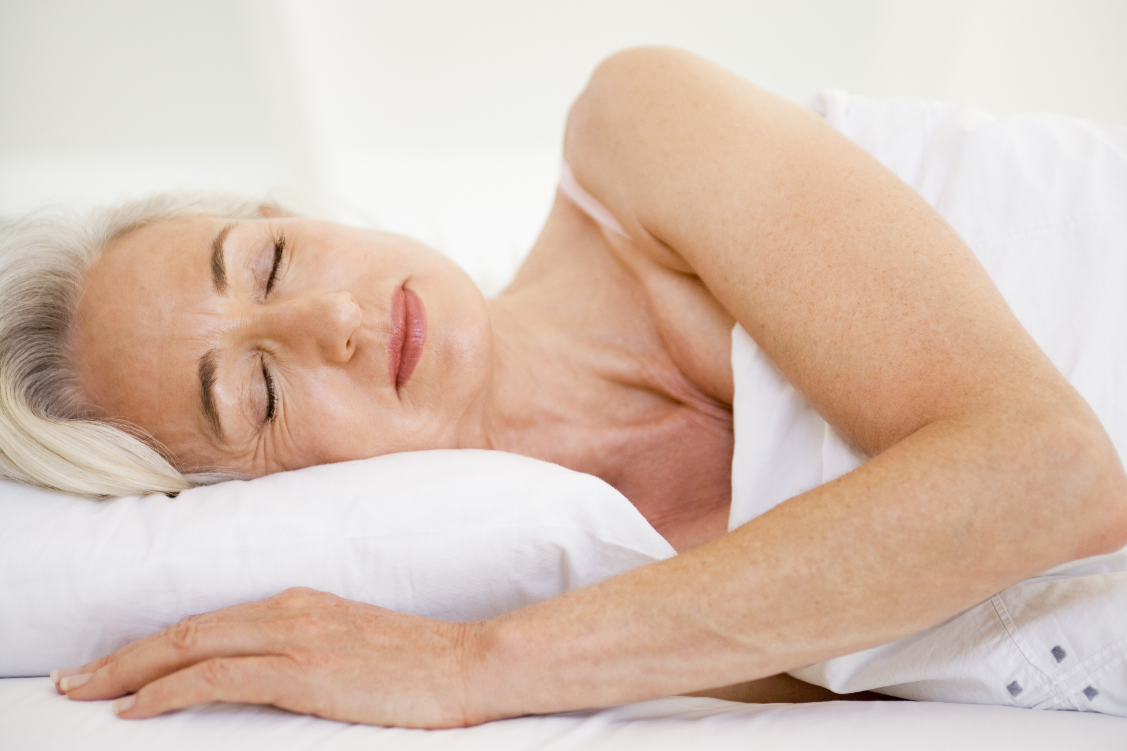 Woman lying in bed sleeping