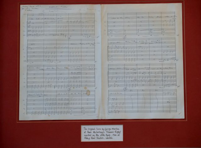 The original handwritten music score for the Beatles song Eleanor Rigby, signed by George Martin and Paul McCartney