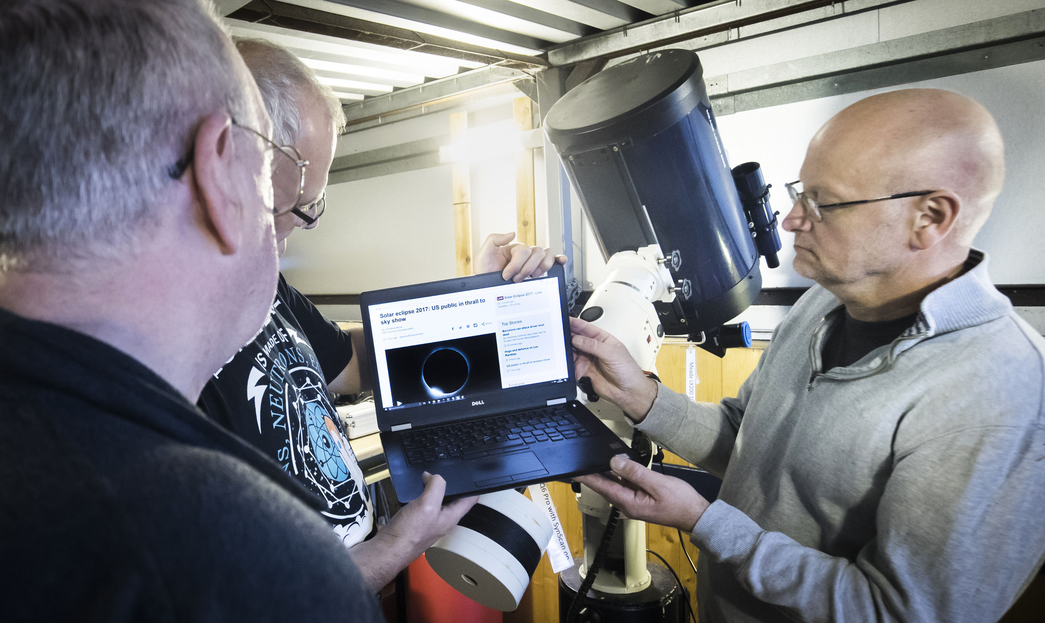 Members of The York Astronomical Society view the solar eclipse on a computer