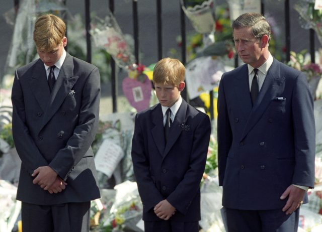 The Prince of Wales, Prince Harry and Prince William walking behind the funeral cortege of Diana, Princess of Wales. 
