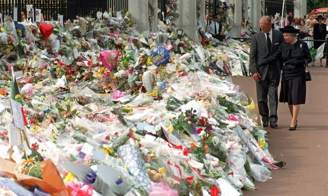 The Queen and the Duke of Edinburgh view the floral tributes to Diana at Buckingham Palace