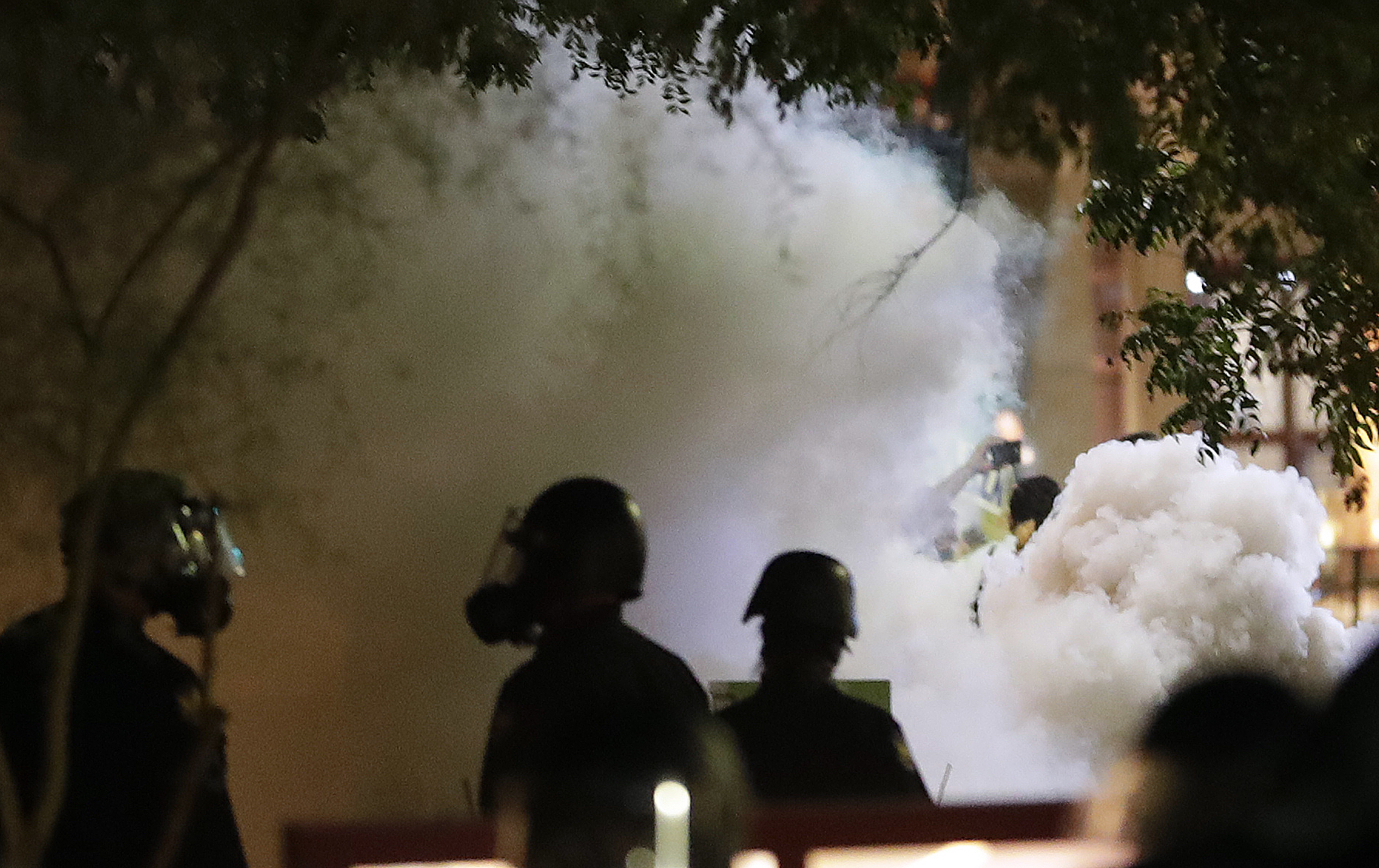 Smoke billows after Phoenix police used tear gas outside the Phoenix Convention Center