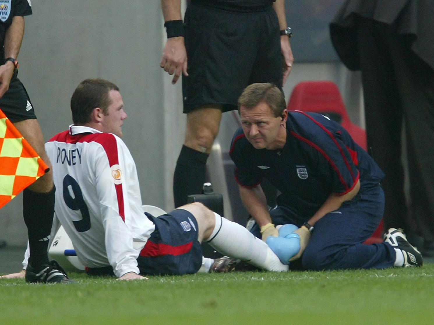 England's Wayne Rooney receives treatment at Euro 2004