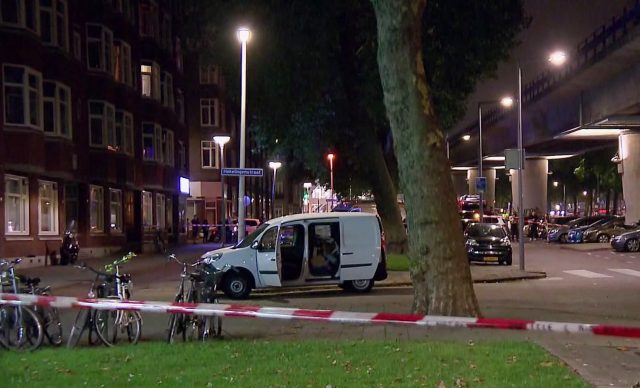 A van is examined behind a cordoned-off area in Rotterdam