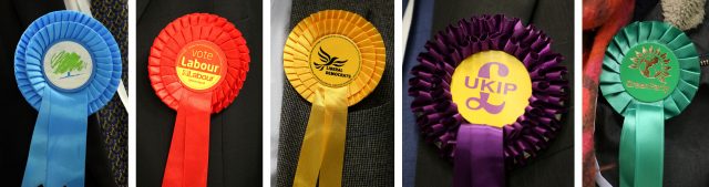 Composite photo of rosettes for (from the left) Conservative Party, Labour Party, Liberal Democrats, Ukip and Green Party