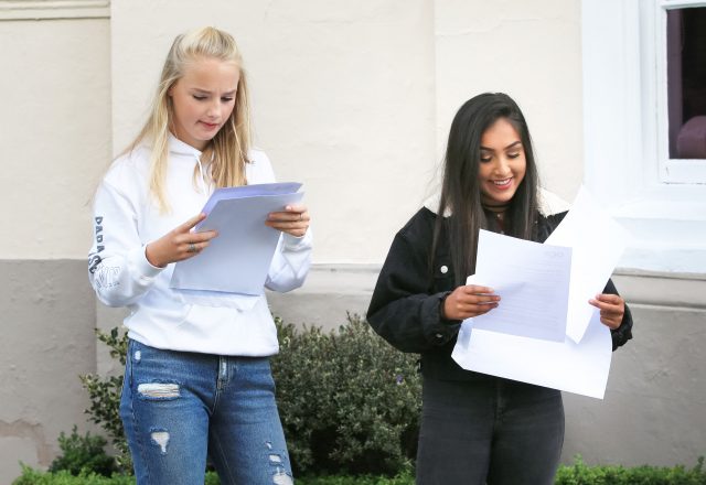 Students left to right Abigail Burton and Nadine Agius at The Mount School York celebrate after collecting their GCSE results