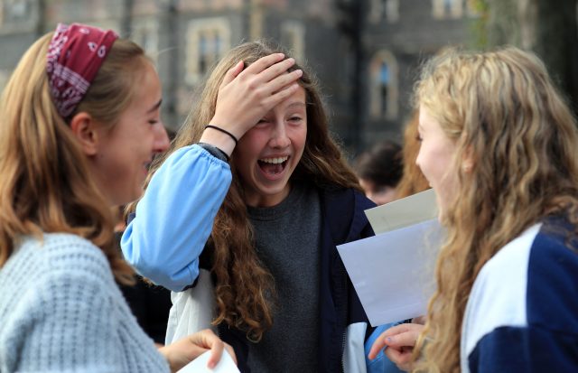 Students at Brighton College in Brighton celebrate after collecting their GCSE results