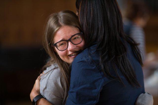 Amy Hutchinson, left, a student at the King Edward VI School in Birmingham celebrates after collecting her GCSE results