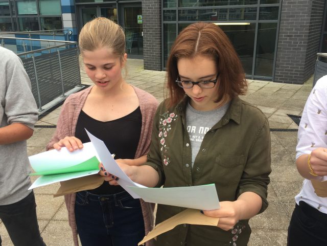 (From left) Sophie Greenwood, 16, and Ella Khanna, 16, celebrate a string of top GCSE grades at St Mary and Temple School in Bristol.