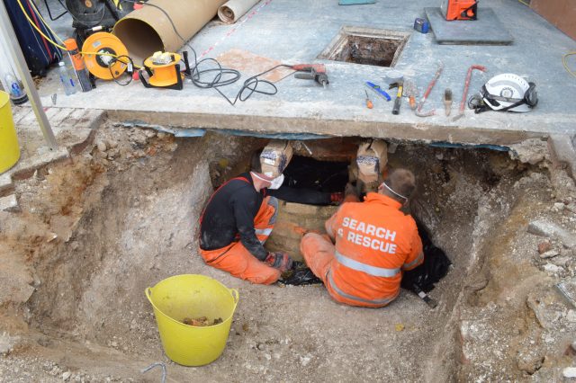 Police teams searching the sewage pit below the garage (Hertfordshire Constabulary/PA)