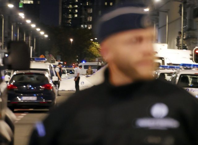 Police secure a scene in Brussels after a knife attack