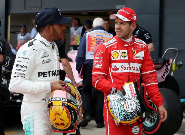 Mercedes' Lewis Hamilton (left) with Ferrari's Sebastian Vettel (right) after qualifying for the 2017 British Grand Prix at Silverstone Circuit, Towcester.
