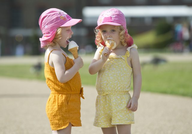 Two little girls enjoy their ice cream
