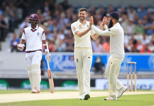 England's James Anderson (centre) celebrates with Moeen Ali after taking the wicket of West Indies Devendra Bishoo during day two of the the second Investec Test match at Headingley, Leeds.