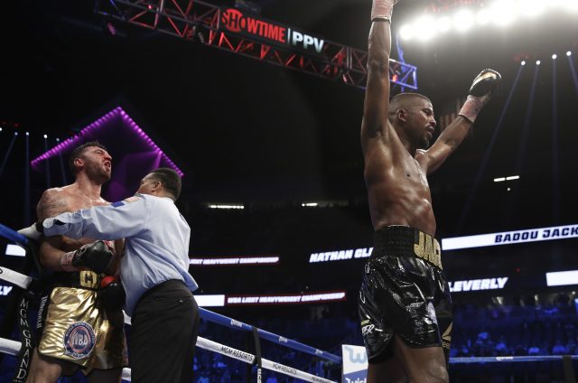 Badou Jack, right, of Sweden, celebrates after defeating Nathan Cleverly