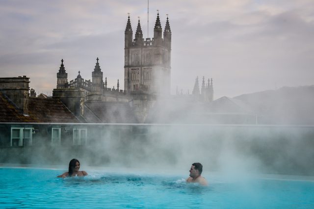 Steam rises above the hot natural spring waters Bath