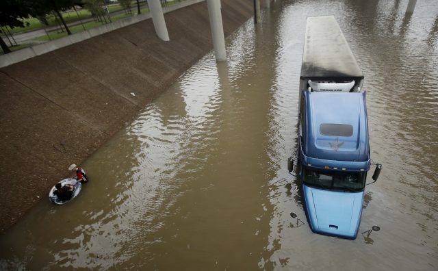 A truck in a flooded freeway
