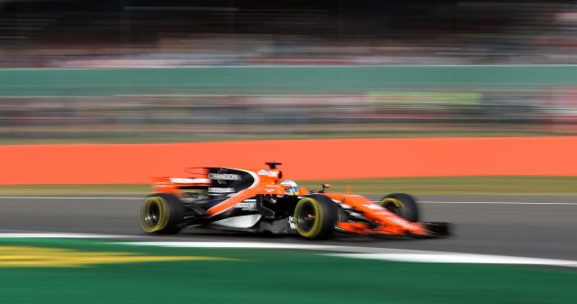 Fernando Alonso drives his McLaren at Silverstone