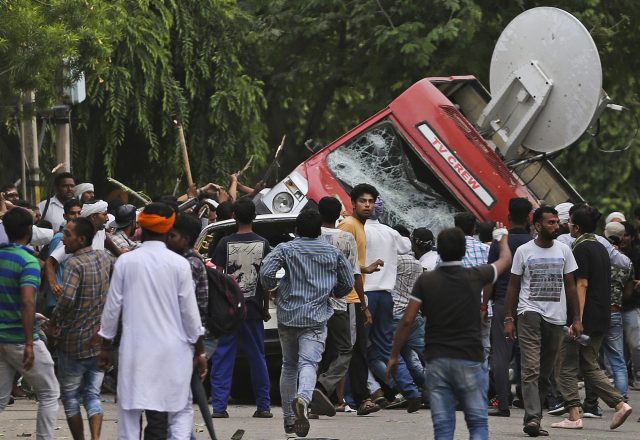 A TV channel van is overturned