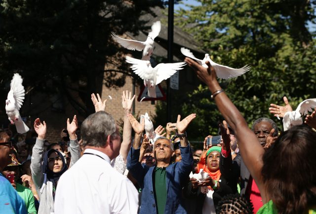 Carnival-goers fall silent for Grenfell Tower blaze victims Carnival-goers fall silent for Grenfell Tower blaze victims